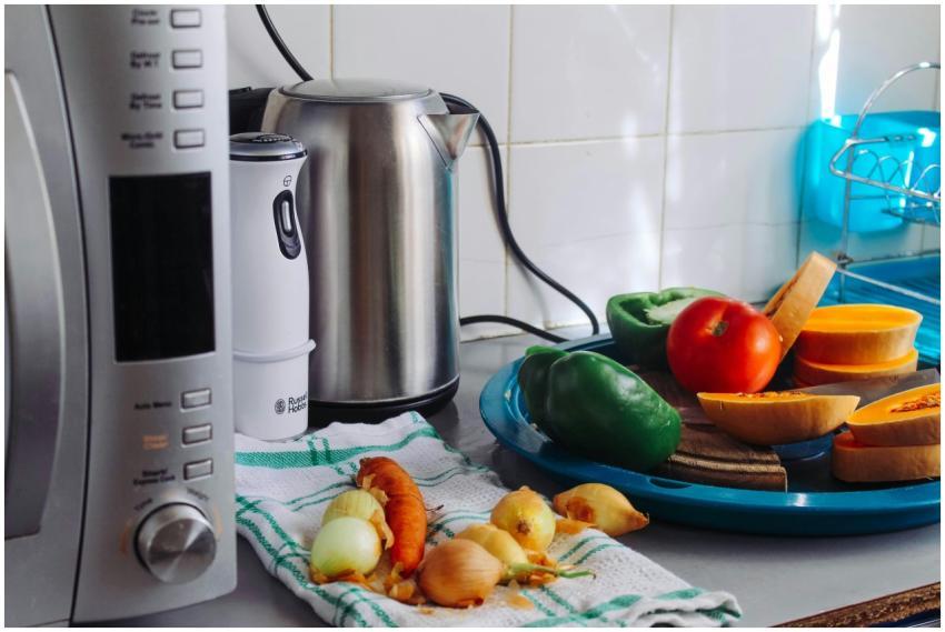 A modern home kitchen counter displaying fresh veg