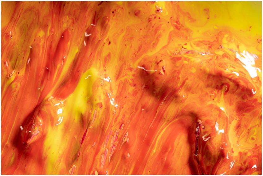 Dynamic close-up of vibrant orange and yellow acry