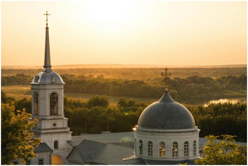 Serene sunset view over a historic church dome ami
