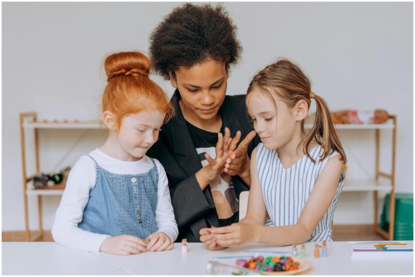 A teacher guiding children in creative activities