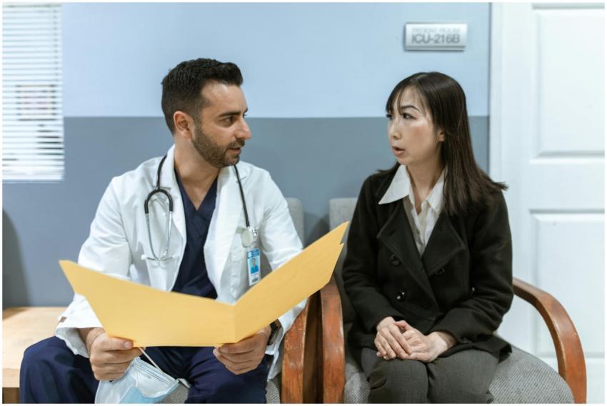 Healthcare professional consults patient in clinic