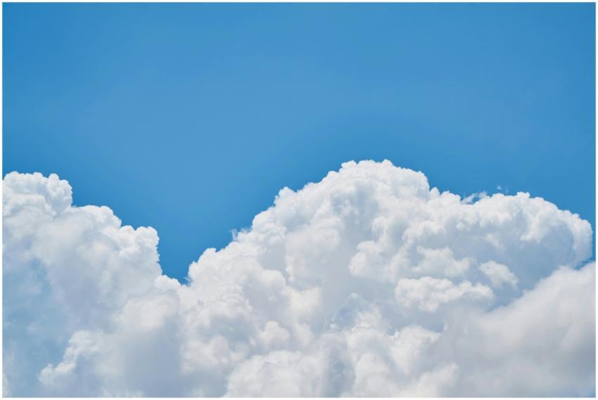 Vibrant image of fluffy white clouds against a cle