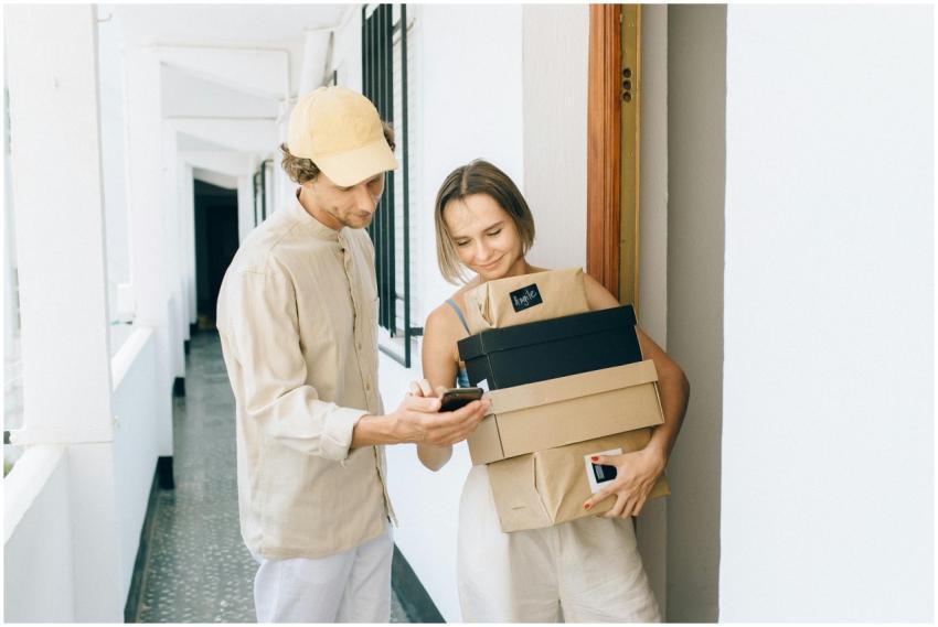 A man and woman engaged in a home delivery package