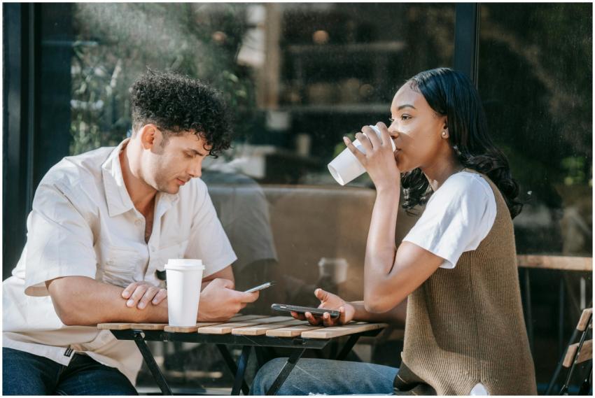 Two friends enjoying a casual coffee break outdoor