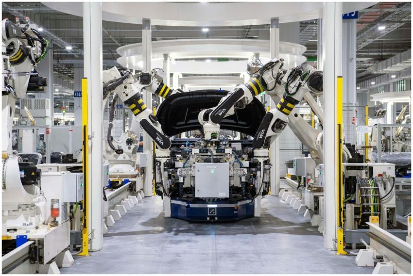 High-tech robots assembling a car in a modern fact