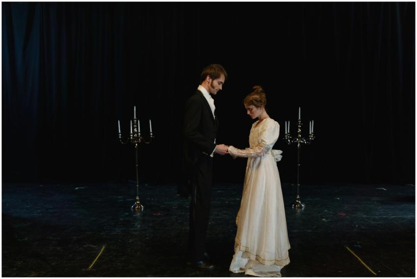 A romantic scene with two actors in period costume