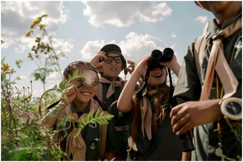 Group of children exploring nature at a summer cam
