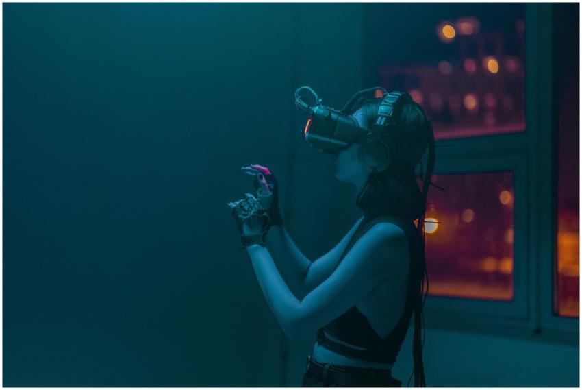 A woman wearing a VR headset and gloves immersed i