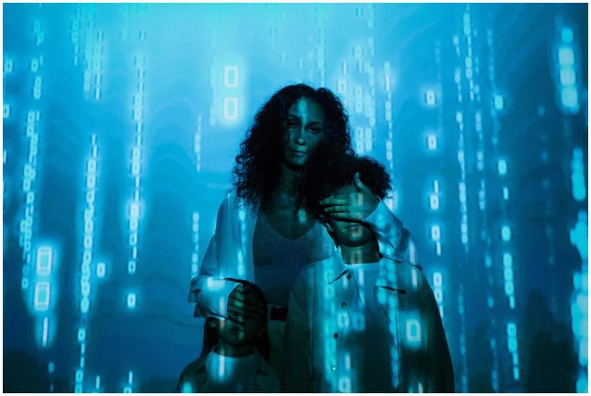 A family stands in digital blue light, symbolizing