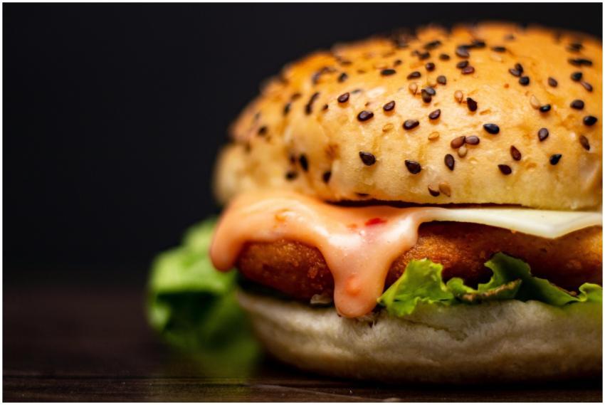 Close-up of a mouthwatering chicken burger with le