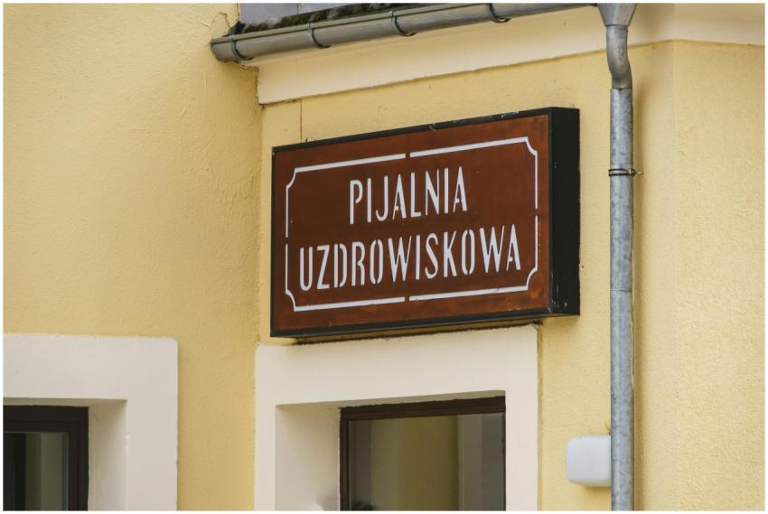 Close-up of a traditional spa sign in Krynica-Zdró