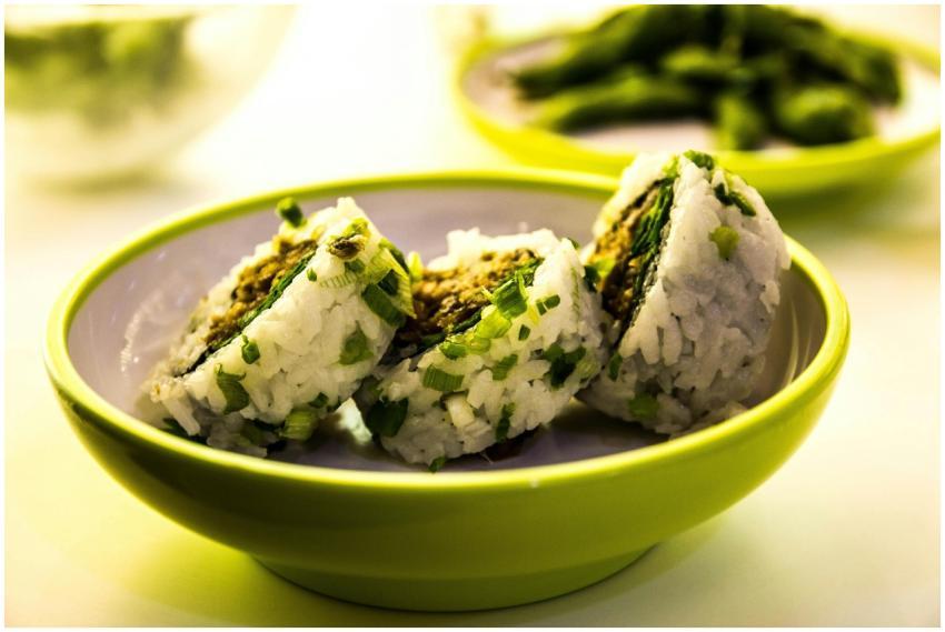 Close-up of sushi rolls garnished with green onion