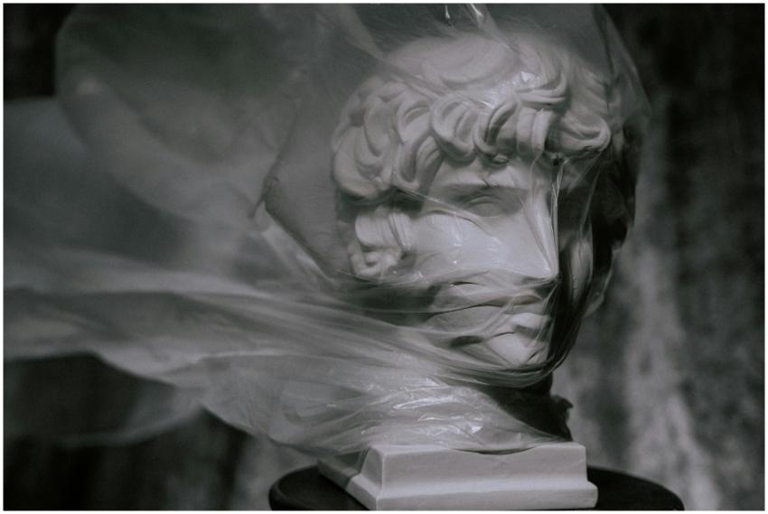 Statue covered with plastic highlighting environme