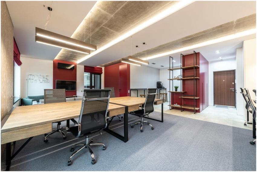 Spacious contemporary office space with wooden des