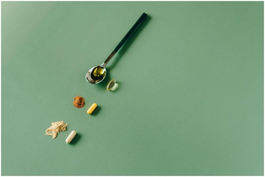 Assorted herbal supplements and powders on a green
