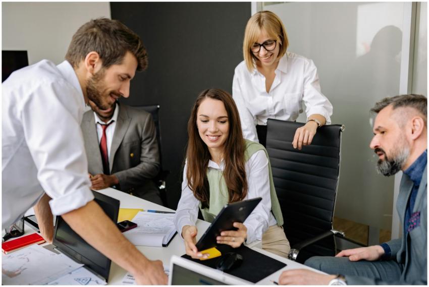 Diverse team collaborating with digital tablet dur