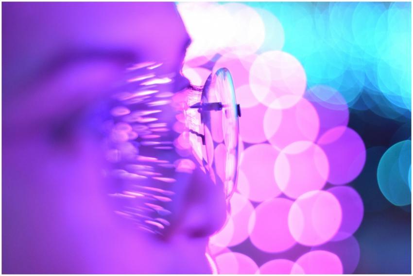 Close-up photo of eyeglasses with bright purple an