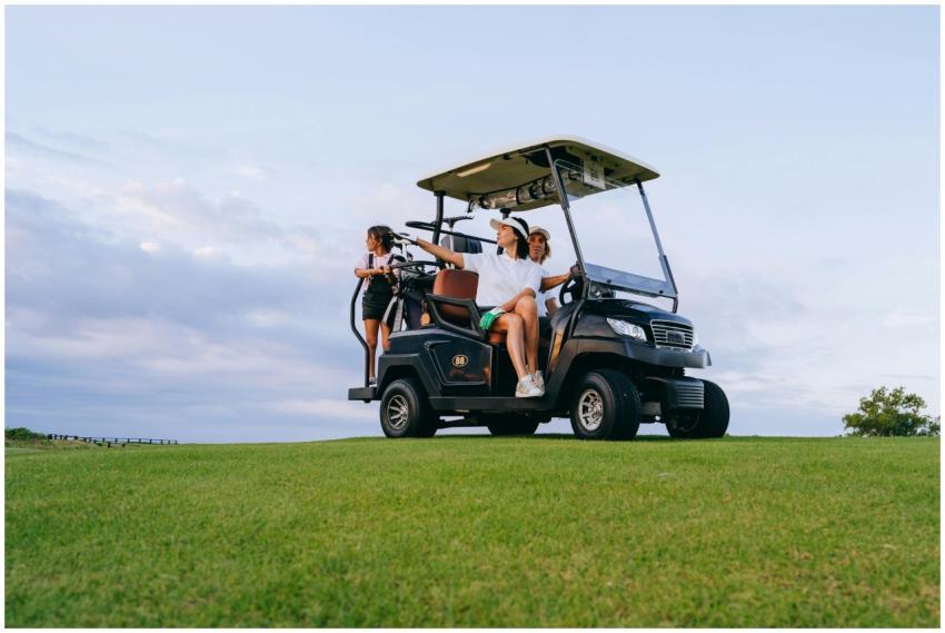 A family enjoys a relaxing golf cart ride on a sun