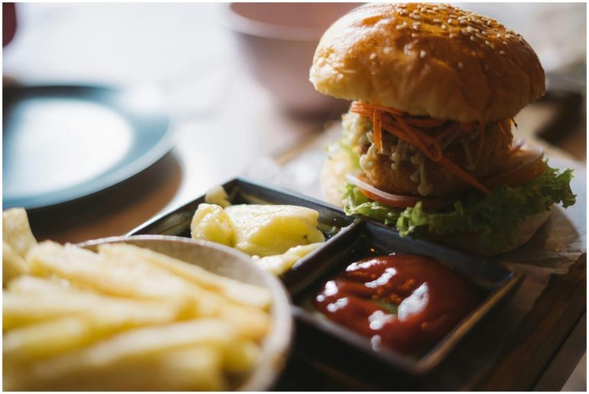 Close-up of a delicious burger with sides of fries
