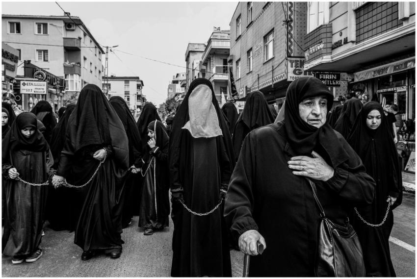 A group of women participate in a religious proces