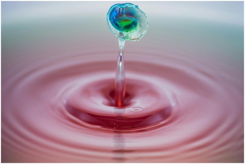 Colorful water droplet captured mid-splash creatin