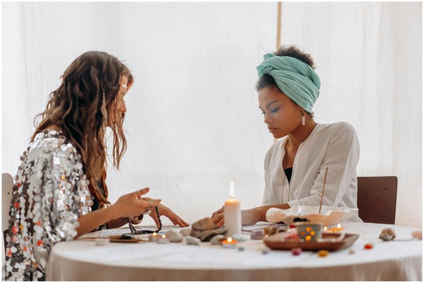 Two women participating in a spiritual ritual with