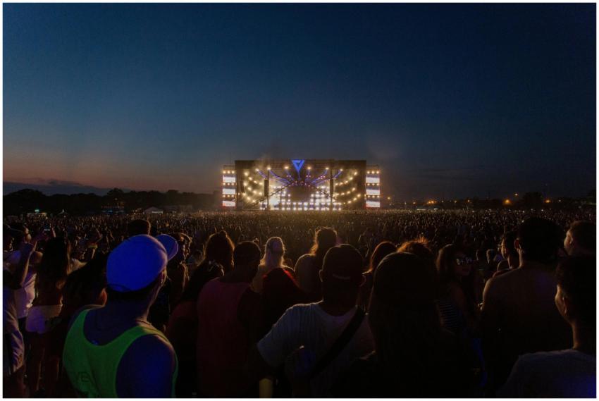 A large audience enjoys a vibrant outdoor concert