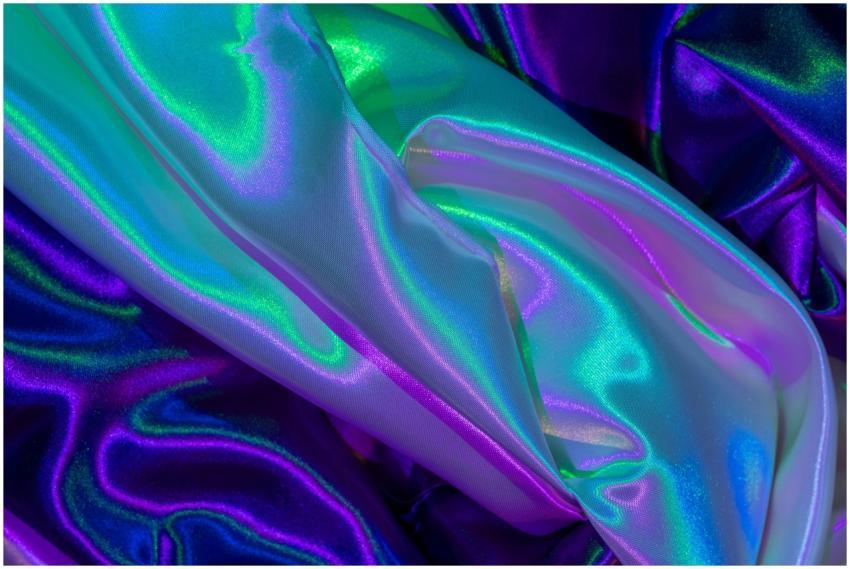 Close-up of colorful iridescent silk fabric with v