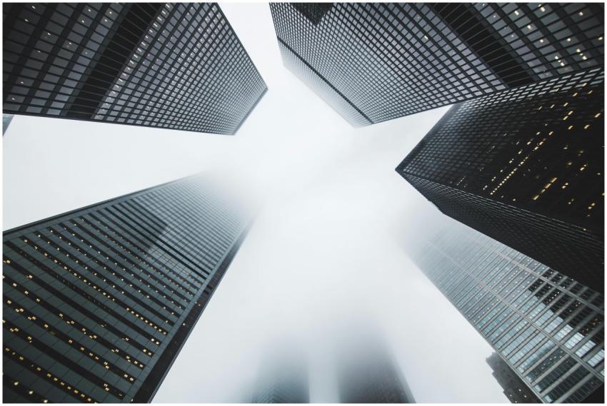 Misty city scene with towering skyscrapers disappe