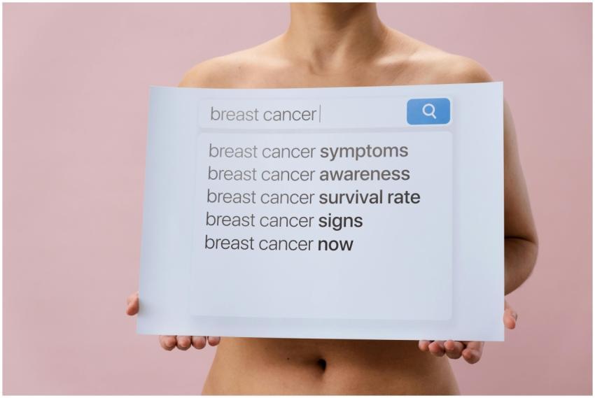 Image showing a person holding a breast cancer awa