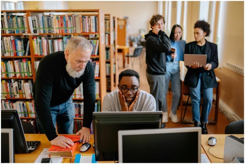 Students and a mentor collaborate in a university