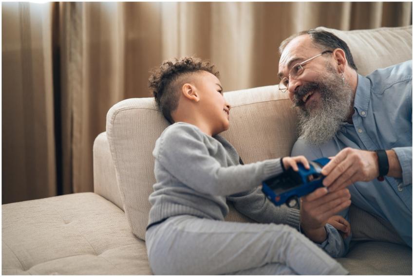 A joyful grandfather and grandson sharing a playfu