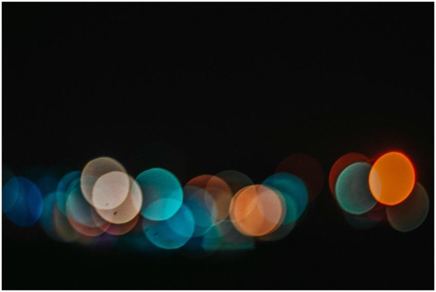 Colorful bokeh lights create a vibrant abstract pa