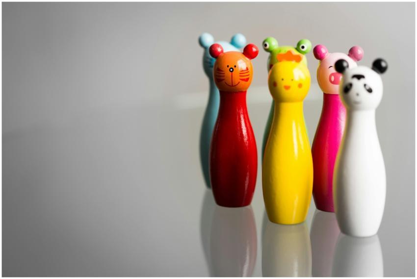 Five vibrant animal-shaped toy figurines in variou