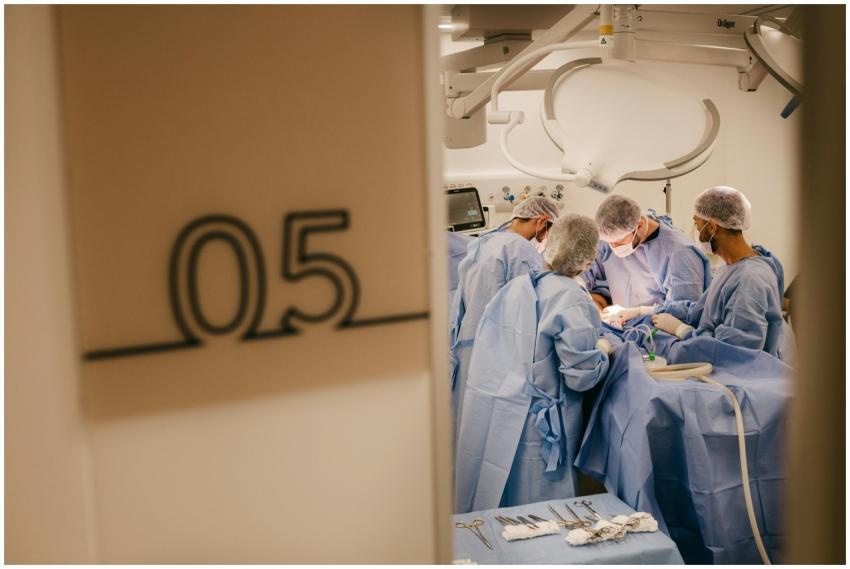 A group of surgeons operates in a hospital's steri