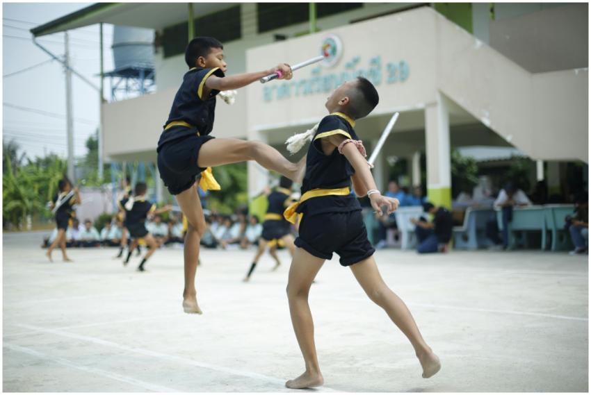 Children practicing Muay Thai martial arts outdoor