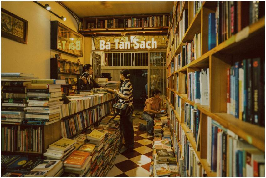 Warm, inviting bookstore with customers browsing b