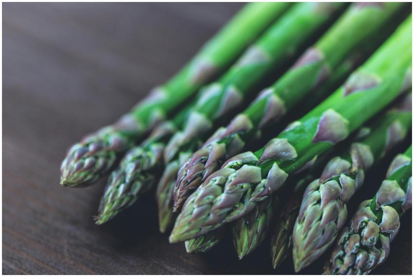 Close-up of fresh green asparagus spears displayed