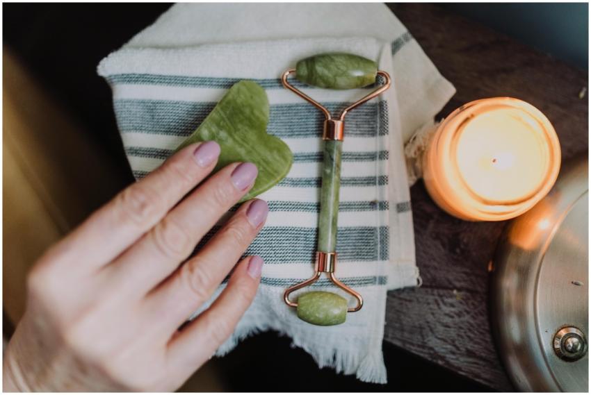 A serene spa setup with a jade roller, heart-shape