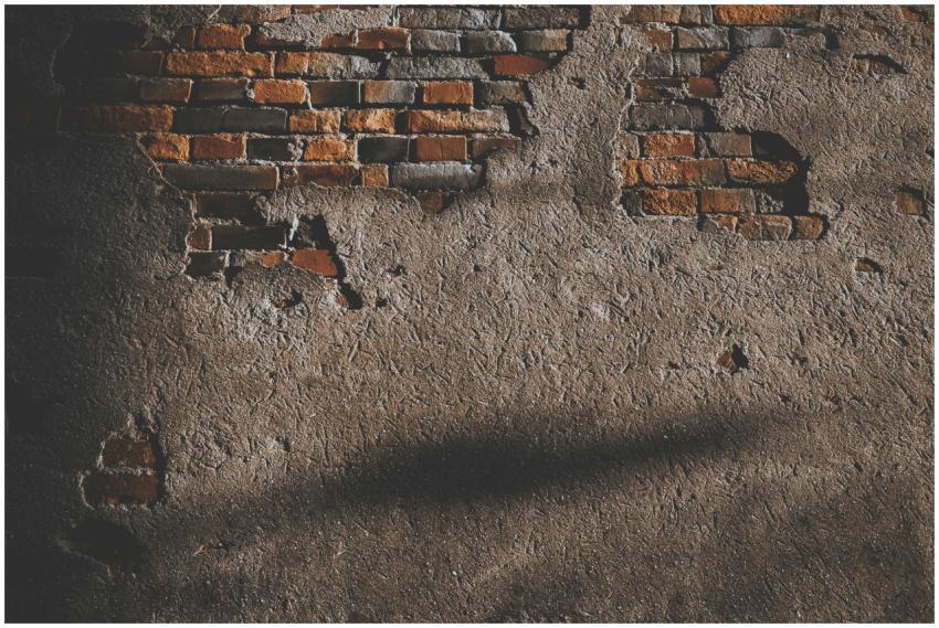 A vintage brick wall with exposed texture, ideal f