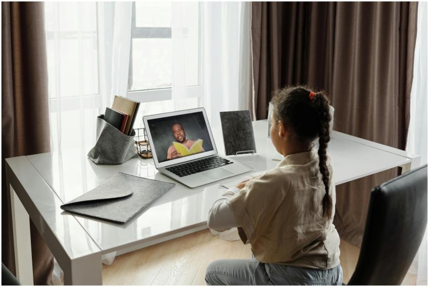 Young girl engaged in a virtual learning session a