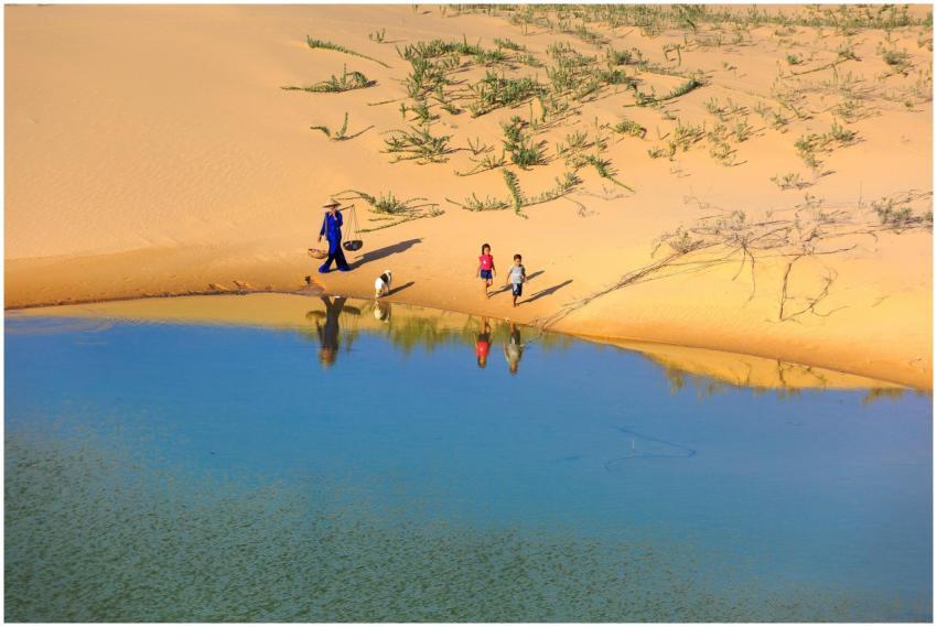 A serene oasis with children and an adult walking