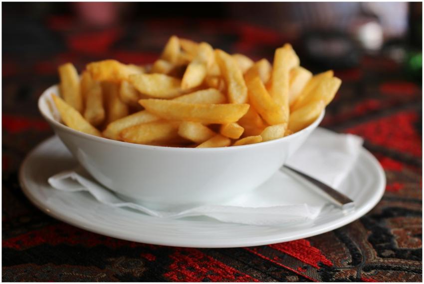 A tempting bowl of golden french fries, perfect fo