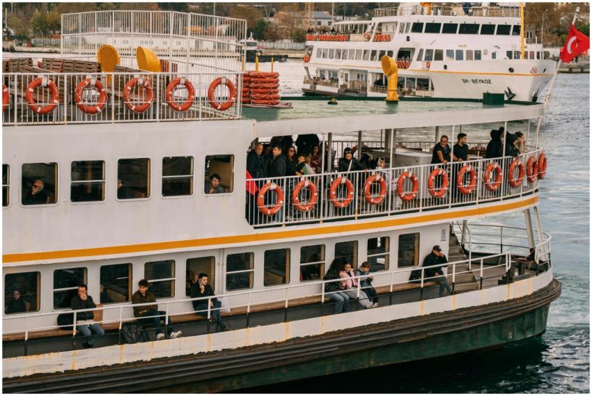 A bustling ferry carries passengers across the Bos