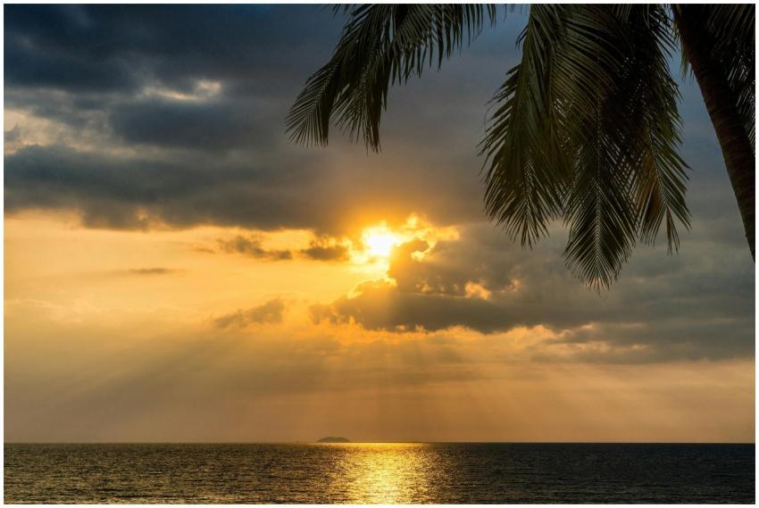 Breathtaking tropical sunset over the ocean with s