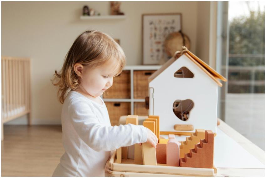A young child engaged in play with educational woo