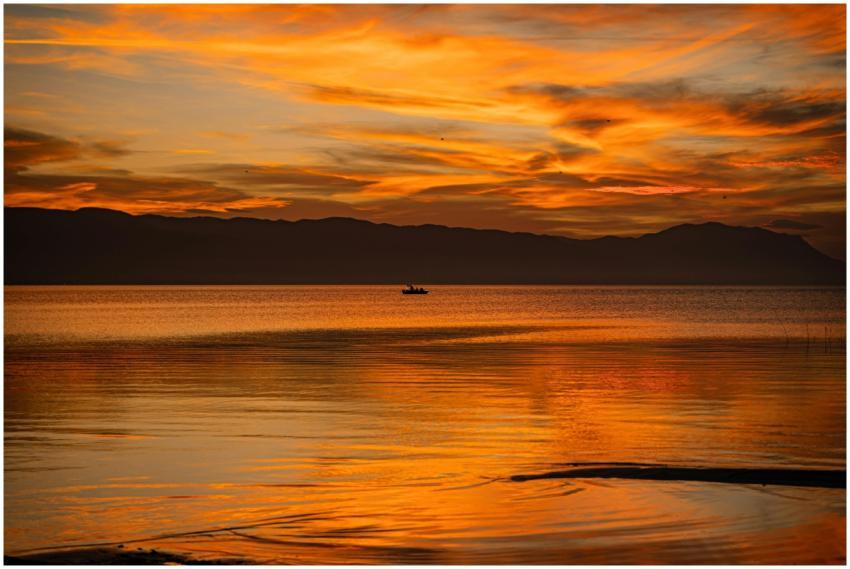 Captivating sunset over a tranquil lake in Bursa,