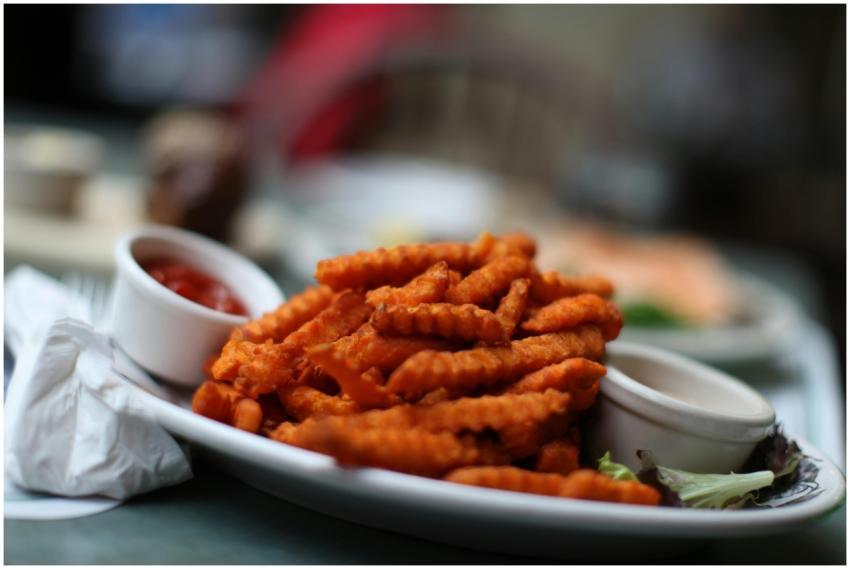 Crinkle-cut sweet potato fries served with ketchup