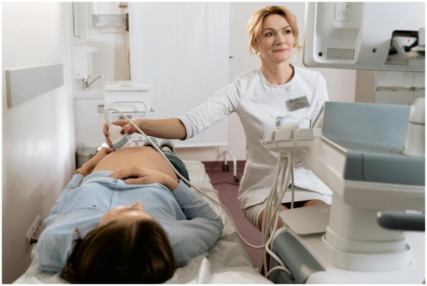 A pregnant woman receiving an ultrasound exam cond