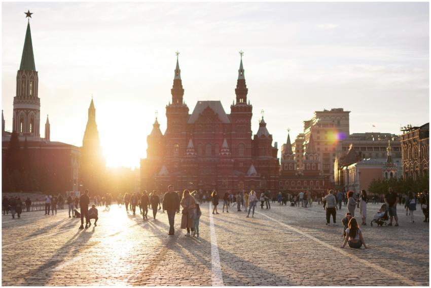 People walking in Red Square, Moscow, with sun set